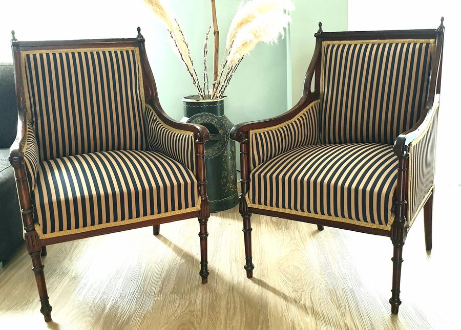 Pair of restored armchairs reupholstered in navy and gold striped fabric